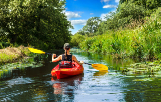Photo of a person embarking on a russian river kayaking tour