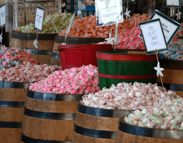 barrels filled with salt water taffy made fresh on the coast in sonoma county